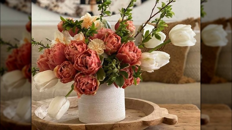 Close up of coral peonies in a flower bouquet.