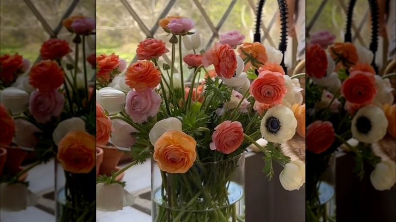 A spring bouquet of orange, pink, and white flowers.