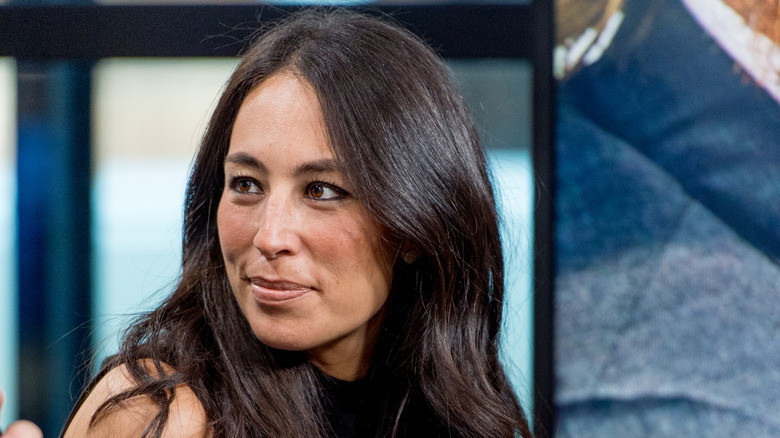 Joanna Gaines looks at speaker
