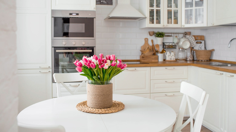 Pink tulips on a kitchen table.