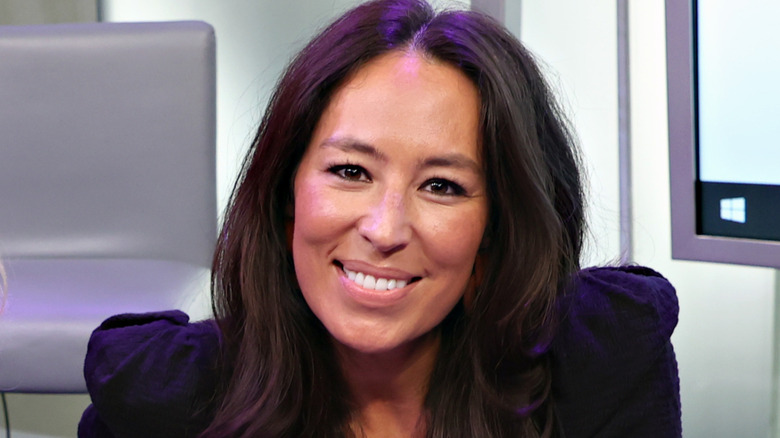 A press headshot of Joanna Gaines smiling.