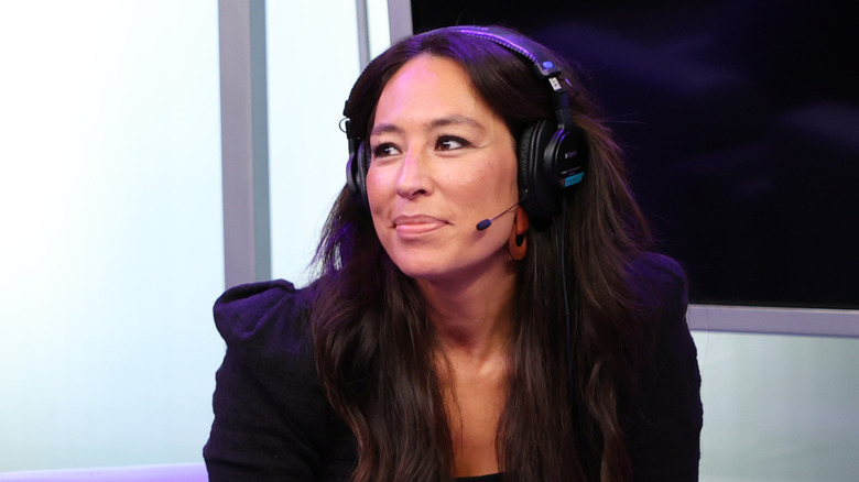 Joanna Gaines smiling with headphones.