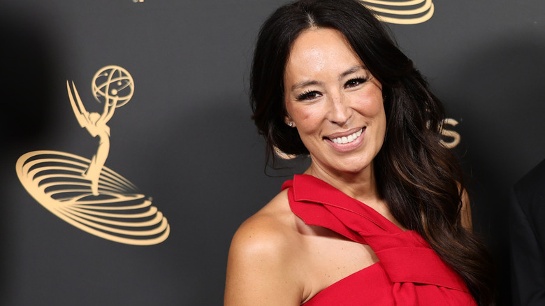 Wearing a red dress, Joanna Gaines attends the 2022 Creative Arts Emmys at Microsoft Theater on September 03, 2022 in Los Angeles, California.