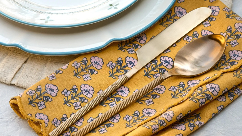 Yellow floral scalloped napkin from Magnolia line