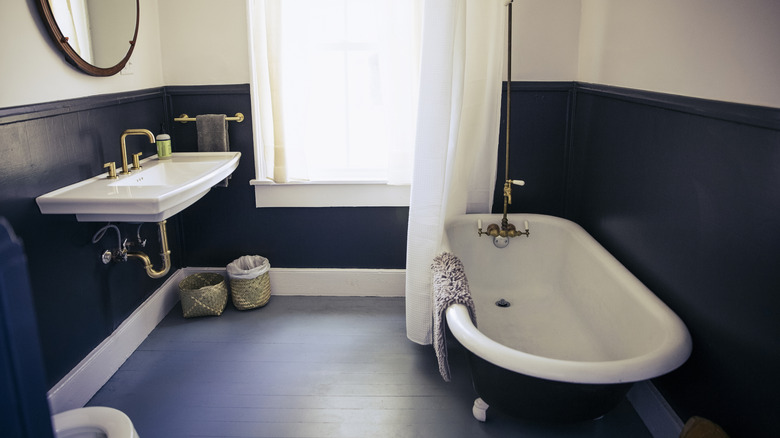 A white gray and navy bathroom