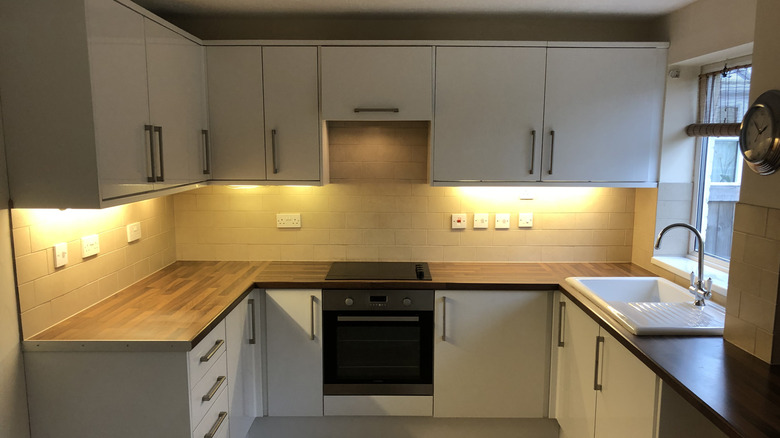 A kitchen with under cabinet lighting