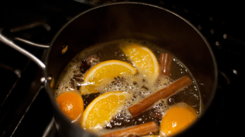 Simmer pot with oranges and cinnamon sticks