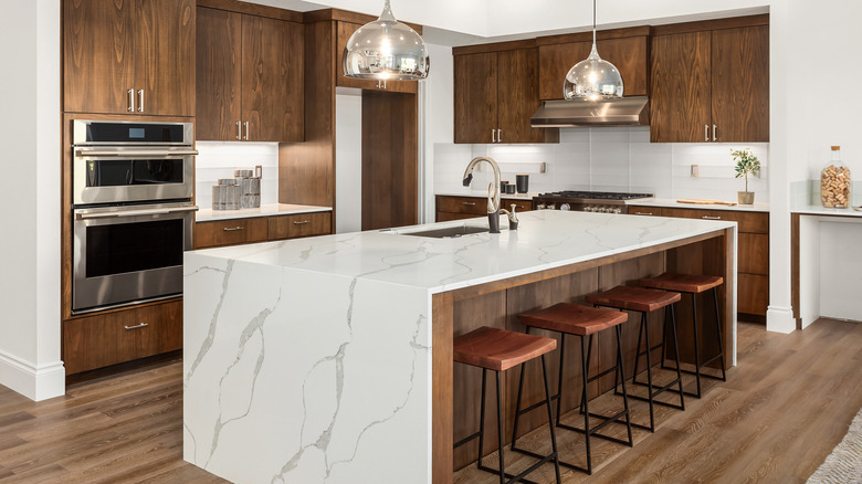 waterfall island with pendant lamps