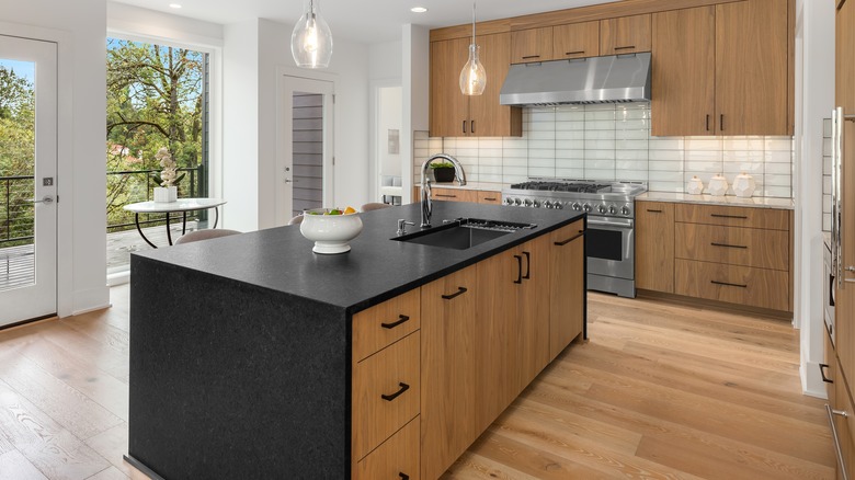waterfall island with cabinets