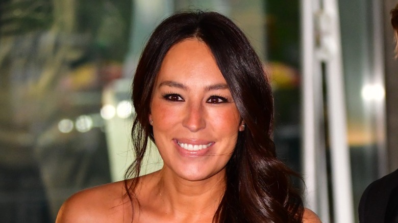 Celebrity designer Joanna Gaines smiling at an event.