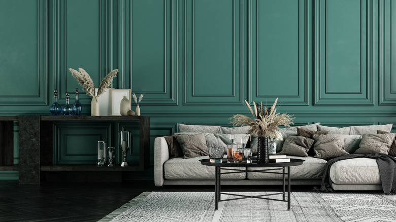 green walls with gray couch