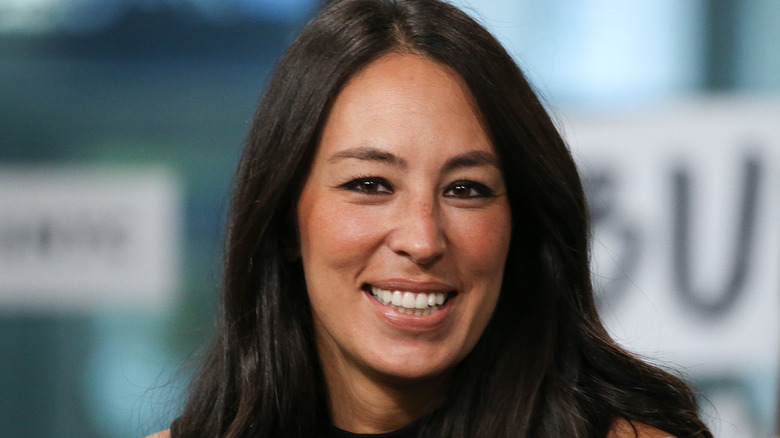 Joanna Gaines smiling wearing black