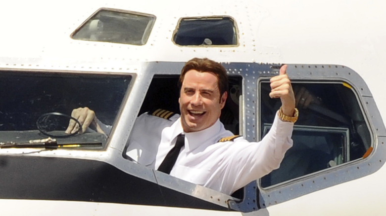 John Travolta piloting a plane