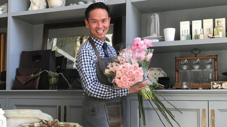 Jonathan Rachman holding flowers