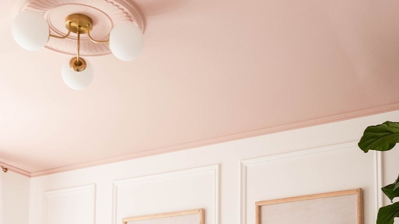 pink ceiling with globe light fixture