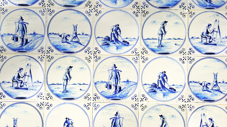 A close up of a mural wall of Delft tiles.