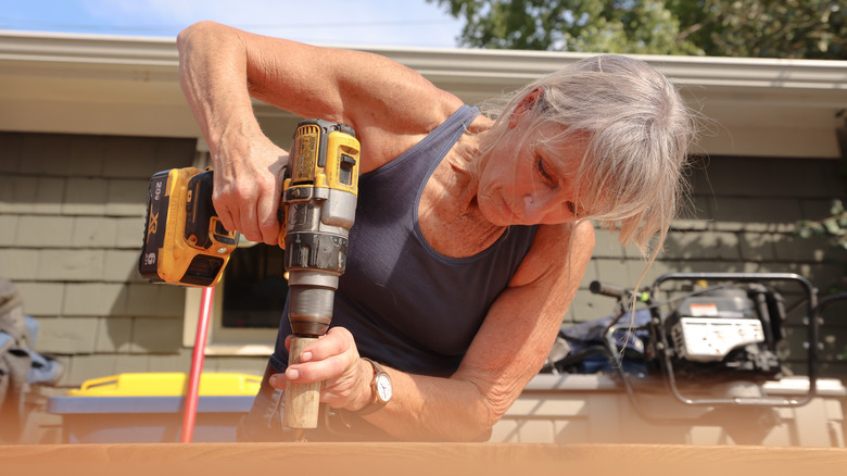 Karen E. Laine constructing a table