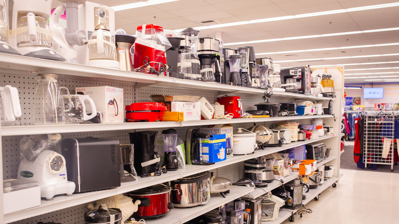kitchenware items on thrift-store shelves