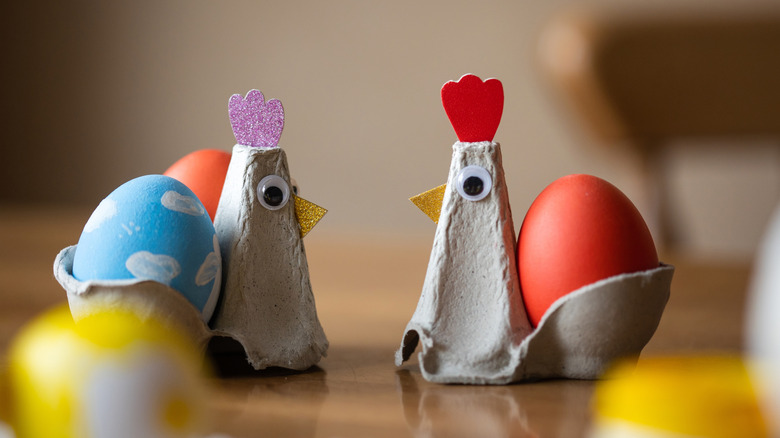 Egg carton chickens holding their eggs
