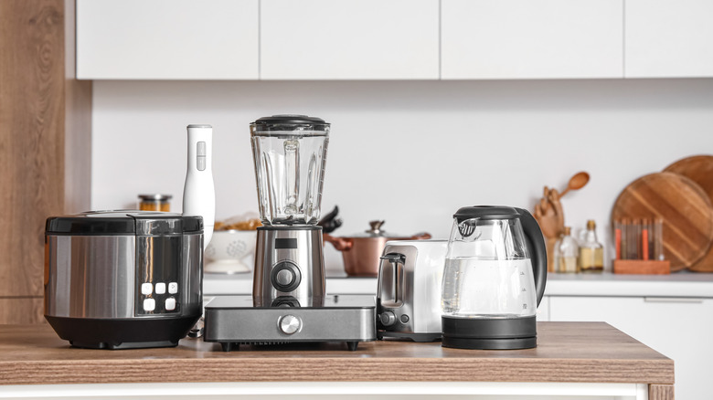 Assorted kitchen appliances resting on an island.
