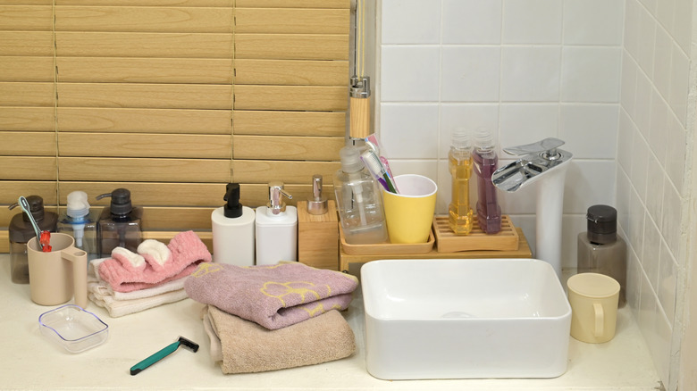 items cluttered on a bathroom counter