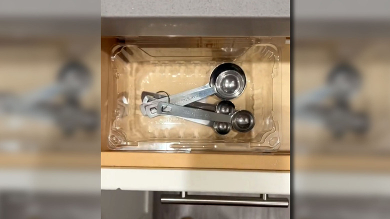 Plastic fruit container used as drawer organizer