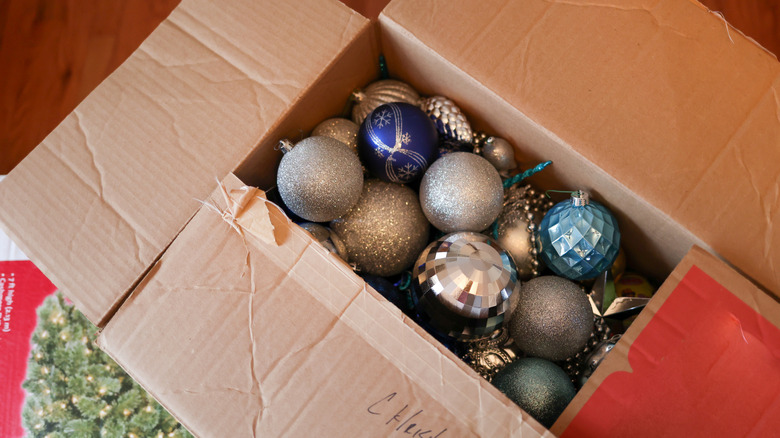 Christmas tree ornaments in an old cardboard box