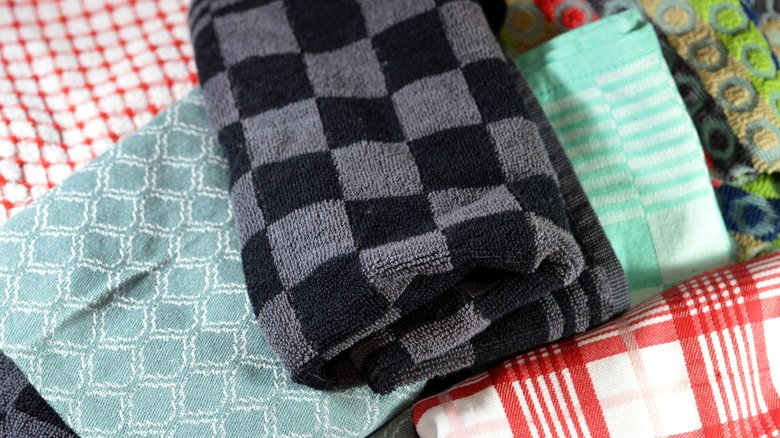 A pile of messy tea towels with different patterns