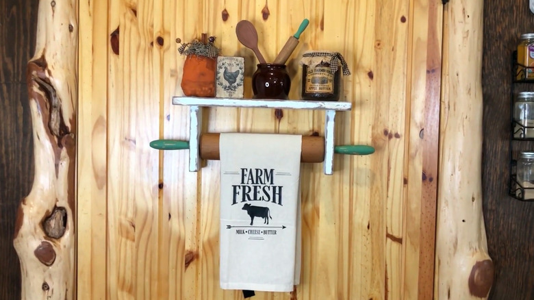 Kitchen towel hung on a shelf made from a rolling pin