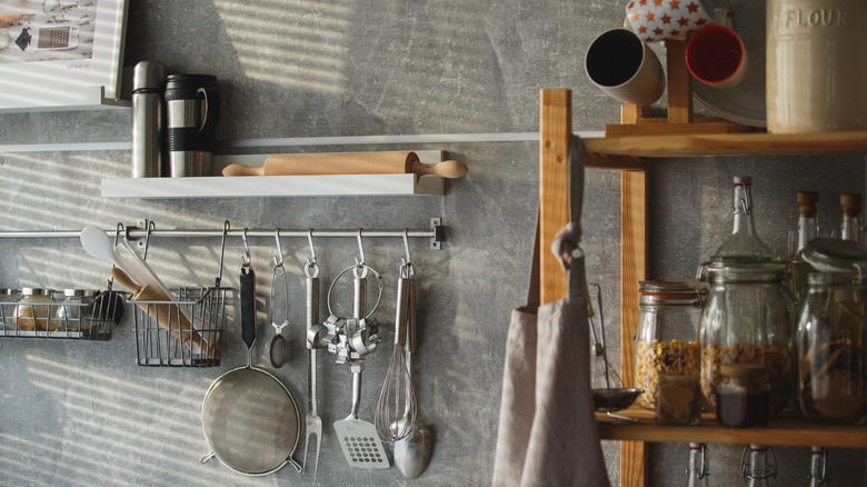 A kitchen with hanging storage on the wall