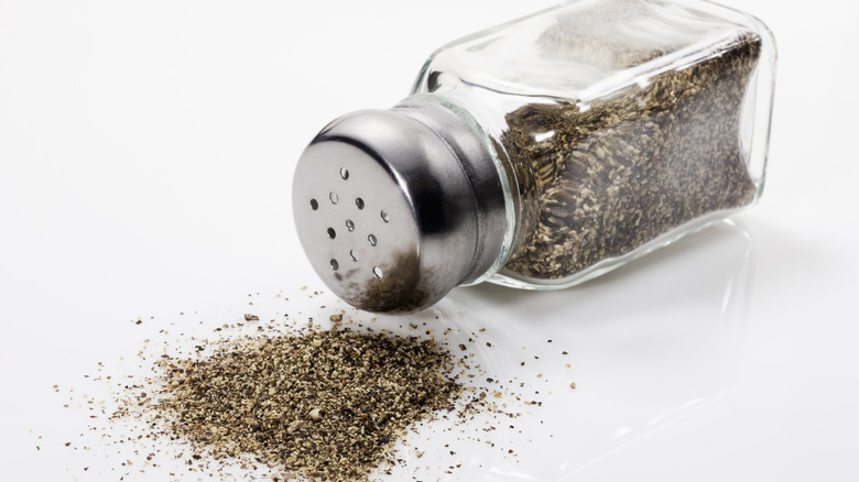 Black pepper poured on the floor
