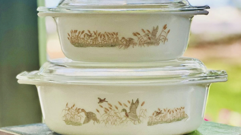 Two "Duck Hunt" Pyrex casserole dishes stacked on top of one another