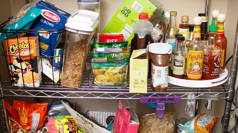 A set of disorganized pantry shelves