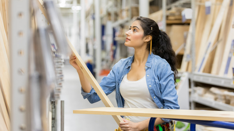 woman buying wood materials 