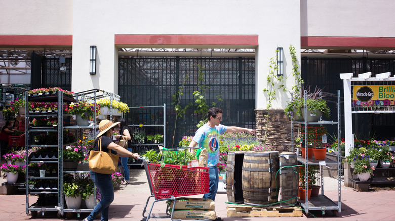 Customers shopping for plants at Lowe's Garden Center.