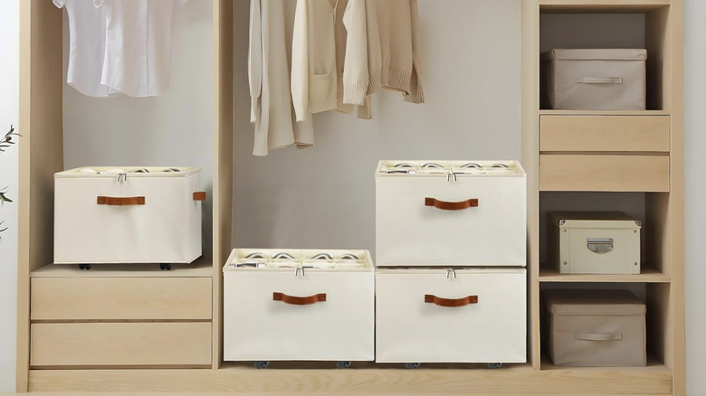Four beige shoe organizers stacked in a closet