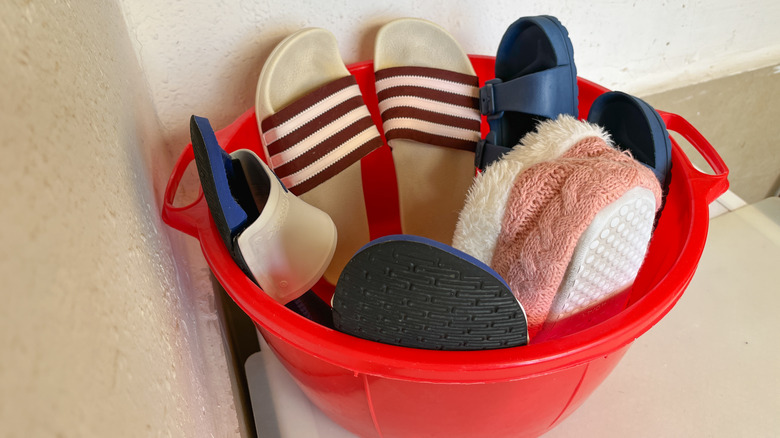 plastic basket with shoes inside