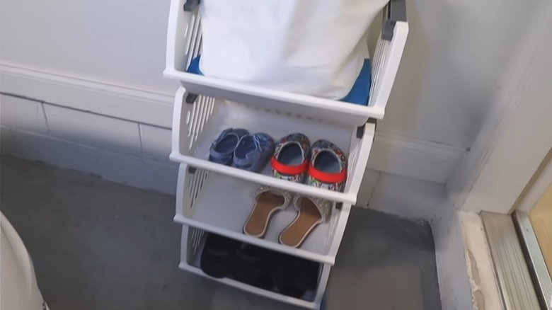 stackable containers from dollar tree holding shoes in garage