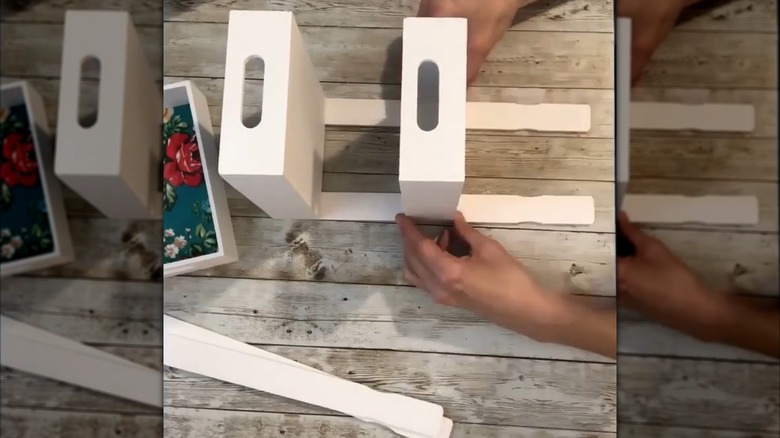 A kitchen countertop or pantry spice shelf made from wooden trays from Dollar Tree.