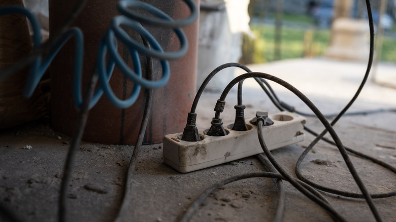 Extension cords and power strip in a garage