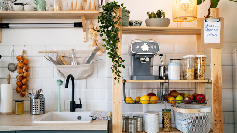 An organized kitchen pantry storage on shelves