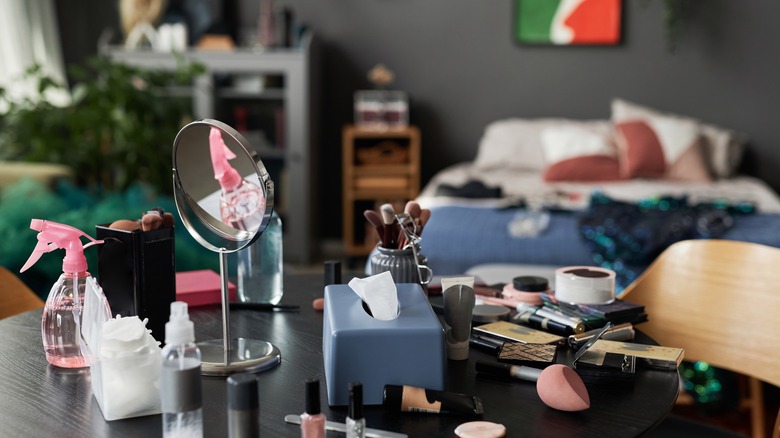 messy vanity table of makeup