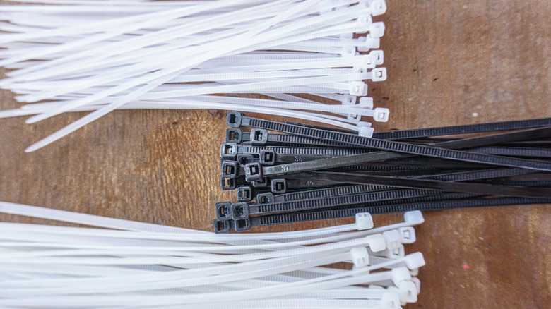 Piles of black and white zip ties