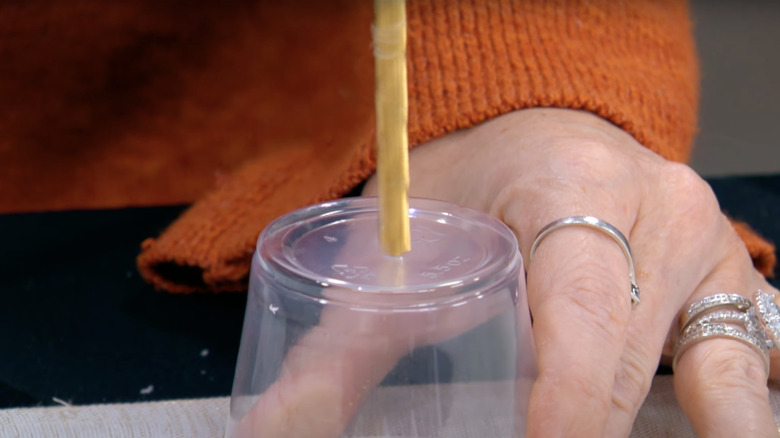 drilling hole in plastic cup