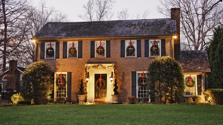 Brick home decorated with wreaths