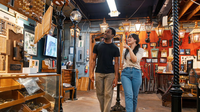 Two people browsing a vintage thrift store