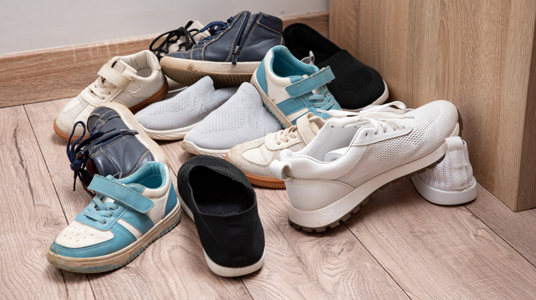 A pile of shoes on the floor