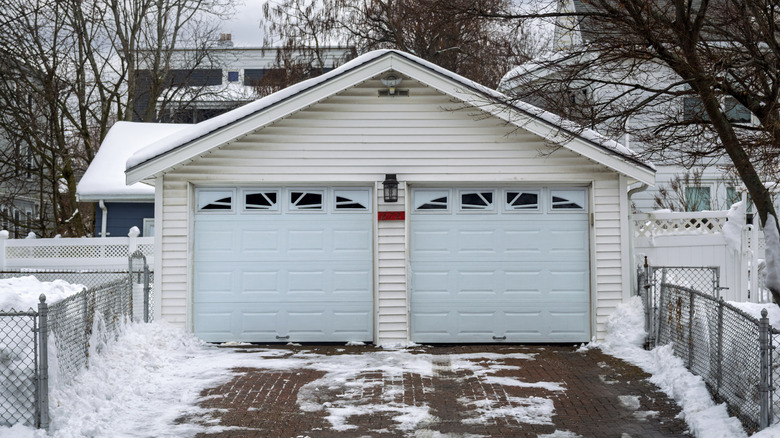 A two car garage on a snowy winter's day