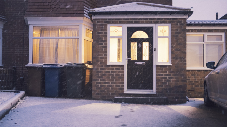 Exterior of home and snowing