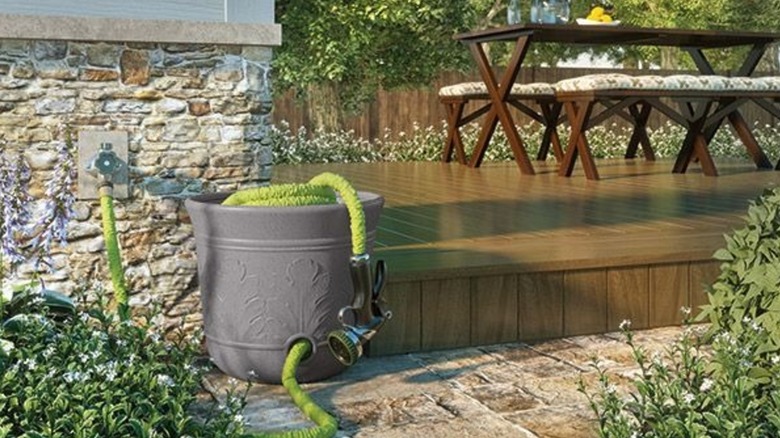 a suncast hose pot hides the ugly mess of a hose and keeps it tangle free